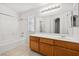 Clean bathroom with a shower-tub combo, and vanity with a mirror at 2333 Silver Crew Pass, Henderson, NV 89052