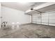 An empty two car garage offers ample storage and parking space at 2333 Silver Crew Pass, Henderson, NV 89052