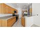 Well-equipped kitchen showcasing wooden cabinets, granite countertops, and modern appliances at 2333 Silver Crew Pass, Henderson, NV 89052