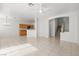 Open living space with tile floors, a ceiling fan, and seamless flow into the kitchen at 2333 Silver Crew Pass, Henderson, NV 89052