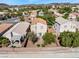 An aerial view shows the home's backyard with mature landscaping and tile roof at 2333 Silver Crew Pass, Henderson, NV 89052