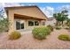 Back of house featuring a covered patio and well-maintained desert landscaping at 2343 Galilean Moon St, Henderson, NV 89044