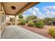 Backyard with desert landscaping with a covered patio, providing a serene outdoor space at 2343 Galilean Moon St, Henderson, NV 89044