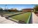 Well-maintained bocce ball courts with lush green playing surfaces and nearby restroom facilities at 2343 Galilean Moon St, Henderson, NV 89044