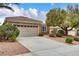 Charming single-story home features a two-car garage and desert landscaping at 2343 Galilean Moon St, Henderson, NV 89044