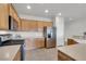 Well-equipped kitchen with stainless steel appliances, ample cabinet space, and neutral countertops at 2343 Galilean Moon St, Henderson, NV 89044