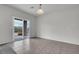 Neutral living room with patio access and tile flooring at 2343 Galilean Moon St, Henderson, NV 89044