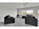 Spacious living room boasts a ceiling fan, recessed lighting, and large windows with views of the landscape at 2343 Galilean Moon St, Henderson, NV 89044
