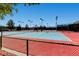 Well-lit tennis courts with colorful playing surfaces and perimeter fencing for a great outdoor activity at 2343 Galilean Moon St, Henderson, NV 89044