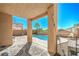 View of backyard featuring covered patio area opening to a swimming pool surrounded by well-kept landscaping at 2496 Citrus Garden Cir, Henderson, NV 89052