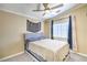 Cozy bedroom featuring a comfortable bed, natural light, and decorative curtains at 2496 Citrus Garden Cir, Henderson, NV 89052