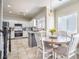 Charming kitchen features a breakfast nook, stainless steel appliances, and ample counter space at 2496 Citrus Garden Cir, Henderson, NV 89052