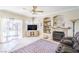 Cozy living room features recessed lighting, an electric fireplace, and comfortable seating at 2496 Citrus Garden Cir, Henderson, NV 89052