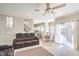 Open concept living room connects to the dining area and features access to the backyard pool at 2496 Citrus Garden Cir, Henderson, NV 89052