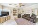 Cozy living room features recessed lighting, an electric fireplace, and comfortable seating at 2496 Citrus Garden Cir, Henderson, NV 89052