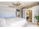 Spacious main bedroom with carpet flooring, fan, and en-suite bath access at 2496 Citrus Garden Cir, Henderson, NV 89052