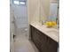 Bright bathroom with dual sinks, modern vanity, and a separate toilet and shower area at 2726 Marchetti Pl, Henderson, NV 89044