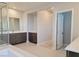 Bathroom featuring double sinks, large mirror, separate shower, and soaking tub at 2726 Marchetti Pl, Henderson, NV 89044