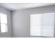 Bedroom featuring two windows with blinds, neutral walls, and carpeted floors at 2726 Marchetti Pl, Henderson, NV 89044