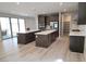 Gorgeous open kitchen with dual islands, stainless steel appliances, and modern finishes at 2726 Marchetti Pl, Henderson, NV 89044