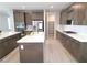 Modern kitchen featuring dual islands, sleek cabinetry, and a spacious pantry for storage at 2726 Marchetti Pl, Henderson, NV 89044