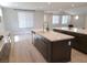Bright kitchen features large islands, pendant lighting, stainless steel appliances, and hardwood floors at 2726 Marchetti Pl, Henderson, NV 89044