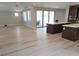 Open-concept living space connecting to a modern kitchen and offering access to the outdoor patio at 2726 Marchetti Pl, Henderson, NV 89044