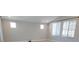 Bright living room with light walls, recessed lighting, and large windows providing ample natural light at 2726 Marchetti Pl, Henderson, NV 89044