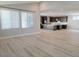 Spacious living area with light floors, recessed lighting, and views into a modern kitchen area at 2726 Marchetti Pl, Henderson, NV 89044