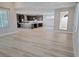 Open-concept living area featuring light floors and seamless flow into the modern kitchen and outdoor space at 2726 Marchetti Pl, Henderson, NV 89044