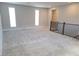 Upstairs loft area featuring neutral walls, plush carpeting, and windows for natural light at 2726 Marchetti Pl, Henderson, NV 89044