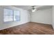 Bedroom featuring laminate floors, ceiling fan, and large window at 3164 Richford Pl, Las Vegas, NV 89102