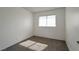 This carpeted bedroom provides a well-lit space thanks to a window with horizontal blinds at 3164 Richford Pl, Las Vegas, NV 89102