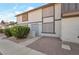 Two-story townhouse with neutral stucco exterior, security door, and low-maintenance landscaping at 3164 Richford Pl, Las Vegas, NV 89102