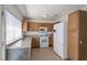 Updated kitchen with granite countertops and wood cabinets at 3164 Richford Pl, Las Vegas, NV 89102