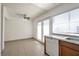 Bright kitchen and eat-in area with granite countertops and tile floors at 3164 Richford Pl, Las Vegas, NV 89102