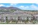 Aerial view showcases new townhome community with mountain views and green landscaping at 334 Laurel Peak Dr, Henderson, NV 89015