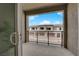 Balcony view showcasing the community's townhome exteriors, and streetscape under a blue sky at 334 Laurel Peak Dr, Henderson, NV 89015