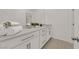 Modern bathroom with a double sink vanity, grey countertop, and sleek hardware at 334 Laurel Peak Dr, Henderson, NV 89015