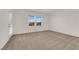 Bright bedroom with carpet, double windows, and a modern aesthetic at 334 Laurel Peak Dr, Henderson, NV 89015