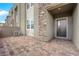 Stylish townhome entrance with a brick patio and stone facade elements at 334 Laurel Peak Dr, Henderson, NV 89015