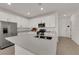 Stylish white kitchen with stainless steel appliances, a large island and lots of countertop space at 334 Laurel Peak Dr, Henderson, NV 89015