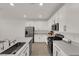 Spacious kitchen with stainless steel appliances, granite countertops, and ample cabinet space at 334 Laurel Peak Dr, Henderson, NV 89015