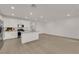 Bright open-concept space with luxury vinyl plank flooring and a view to the kitchen at 334 Laurel Peak Dr, Henderson, NV 89015