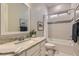 Bright bathroom features granite counters, a soaking tub, and tiled shower with curtain at 3434 Boleo Ct, Las Vegas, NV 89141