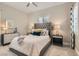 Neutral guest bedroom featuring a comfortable bed and plantation shutters for adjustable lighting at 3434 Boleo Ct, Las Vegas, NV 89141