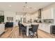 Modern kitchen with white cabinets, a spacious island, and stainless-steel appliances, perfect for entertaining at 3434 Boleo Ct, Las Vegas, NV 89141