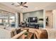 Spacious living room with lots of natural light and a view of the backyard through a sliding glass door at 3434 Boleo Ct, Las Vegas, NV 89141