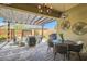 Inviting outdoor patio with a pergola, decorative lighting, comfortable seating, and stylish outdoor decor at 3434 Boleo Ct, Las Vegas, NV 89141