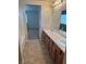 Bathroom features double sinks, tile floors, and a view of an adjacent bedroom at 3748 Autumn King Ave, Henderson, NV 89052